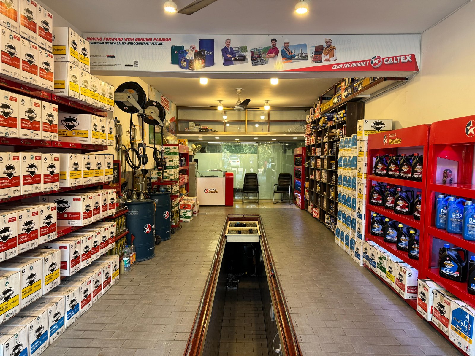 Front desk and shelves at Lubri Care Xpress, G-8 Markaz, Islamabad